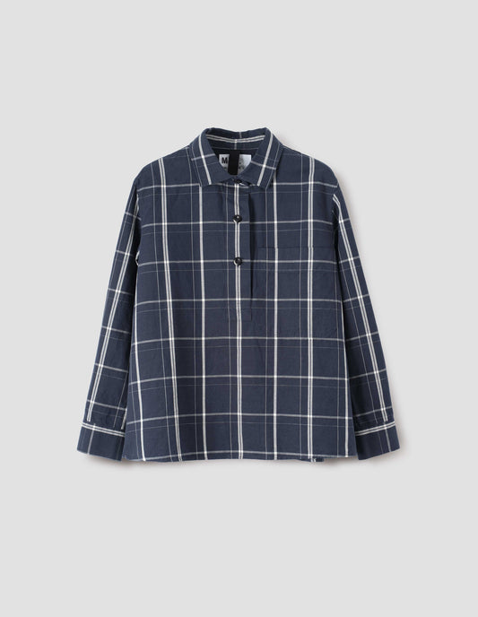 Navy and white checked shirt with raised placket, corozo brace buttons, large dropped check patch pocket and gusset stitching. Front flat lay view.