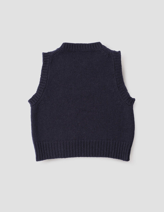 Navy blue sleeveless knitted vest with contrasting neckline, hem and deep armholes. Back flat lay view.