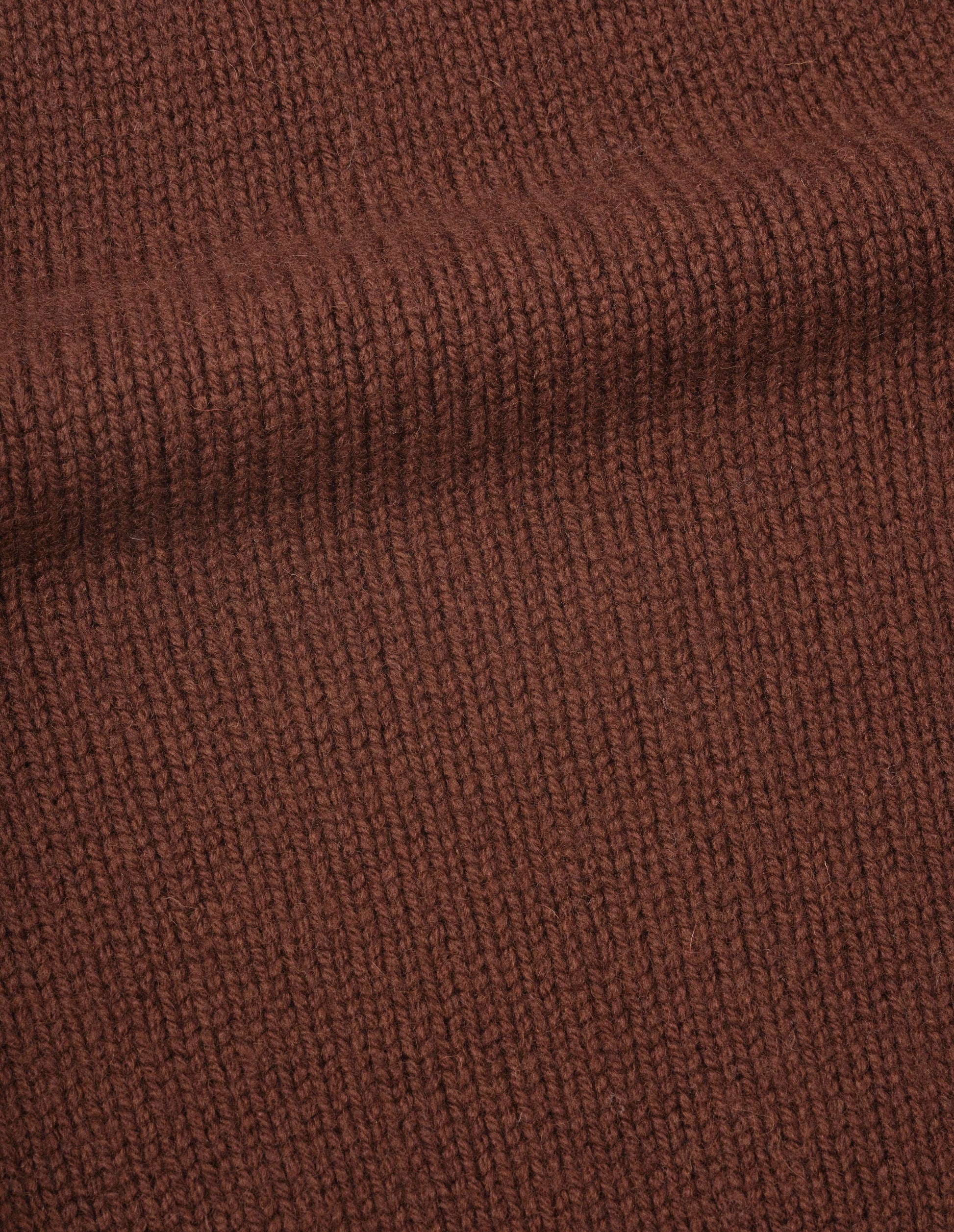 Red brown British merino wool knitted slipover, fabric swatch.