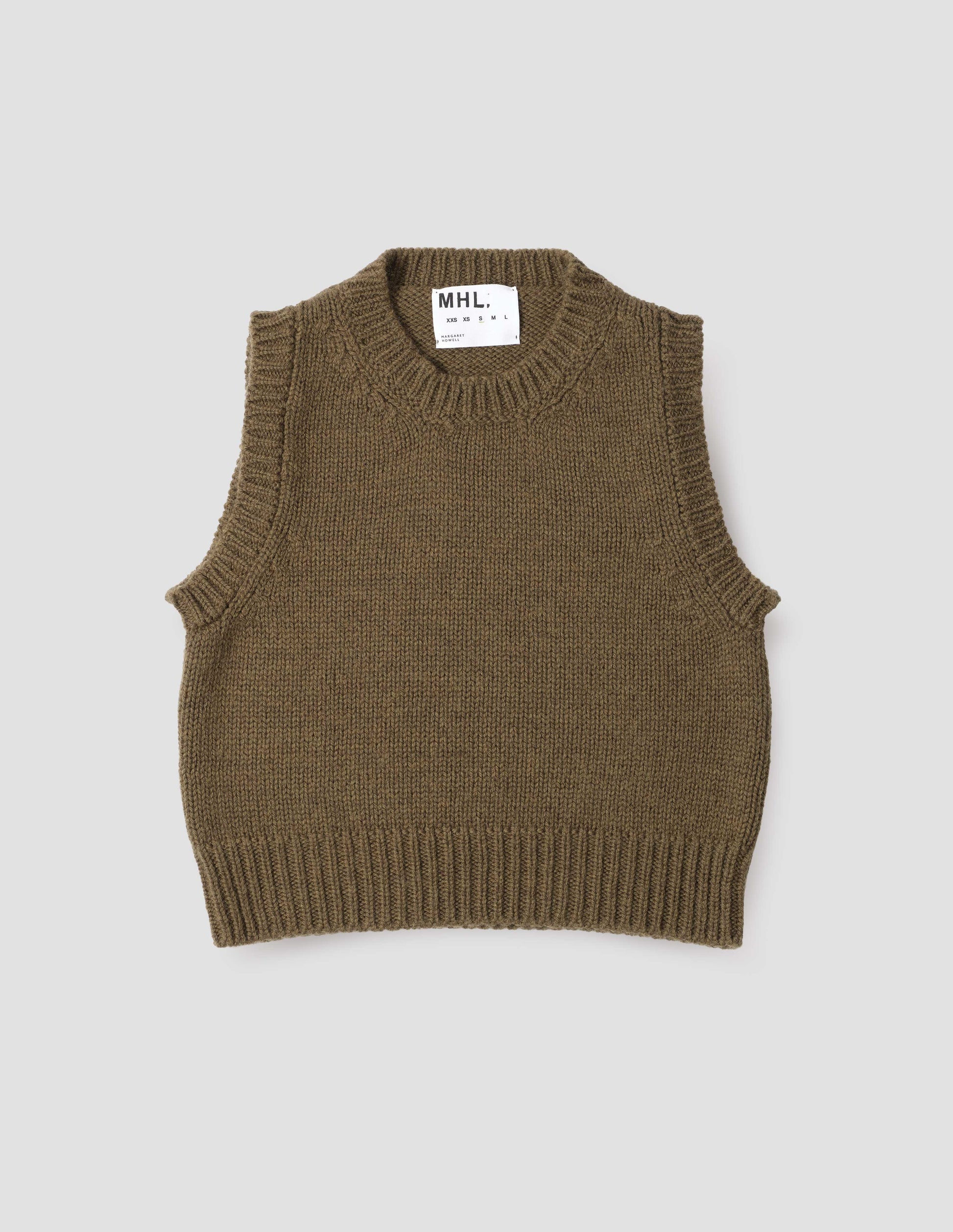 Beige green sleeveless knitted vest with contrasting neckline, hem and deep armholes. Front flat lay view.