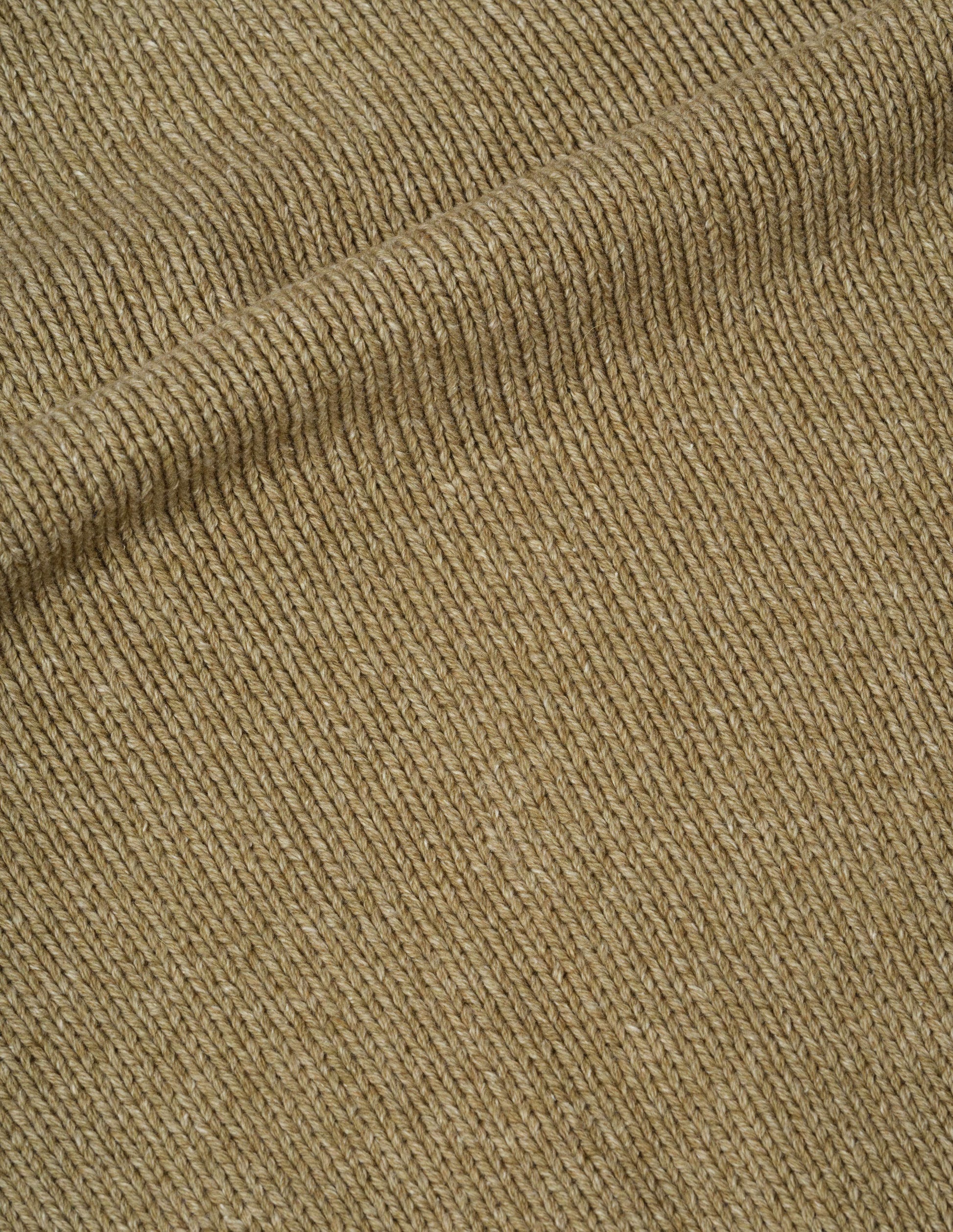 Light green wool cotton jumper fabric swatch.