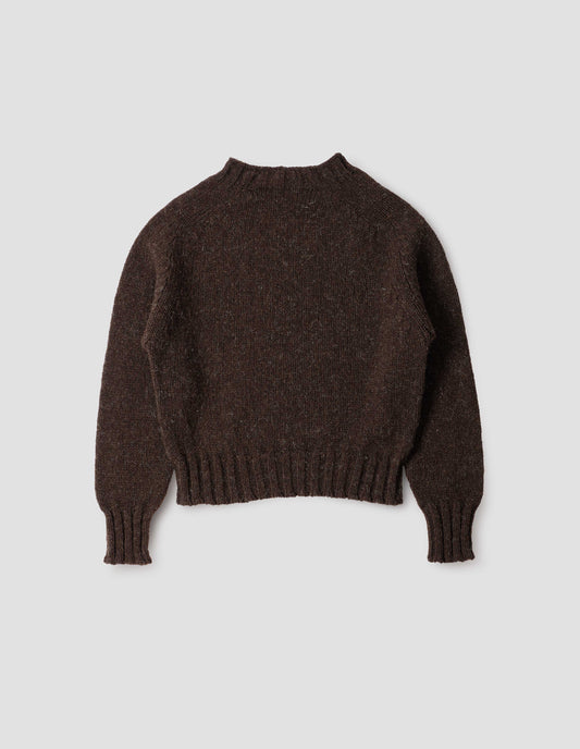Dark brown rustic wool jumper with saddle sleeve and contrasting rib on neck, cuffs and hem. Back flat lay view.