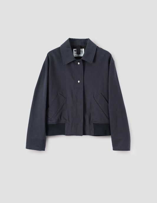 Dark navy collared jacket with press stud closure, slant deep welt pockets and ribbed hem, front flat lay view.
