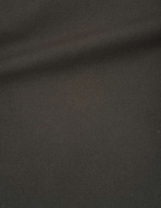 Dark green trousers, dry cotton gabardine fabric swatch. 