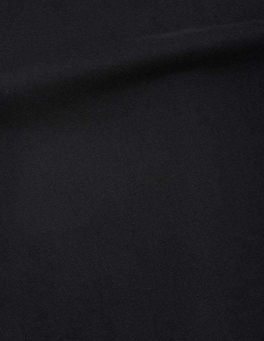 Black cotton denim skirt fabric swatch.