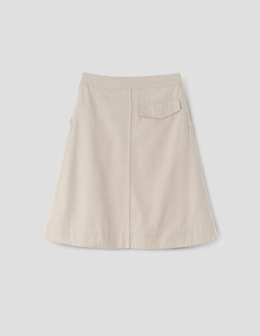 Beige A-line skirt with deep stitch hem and back flap pocket, back flat lay view.
