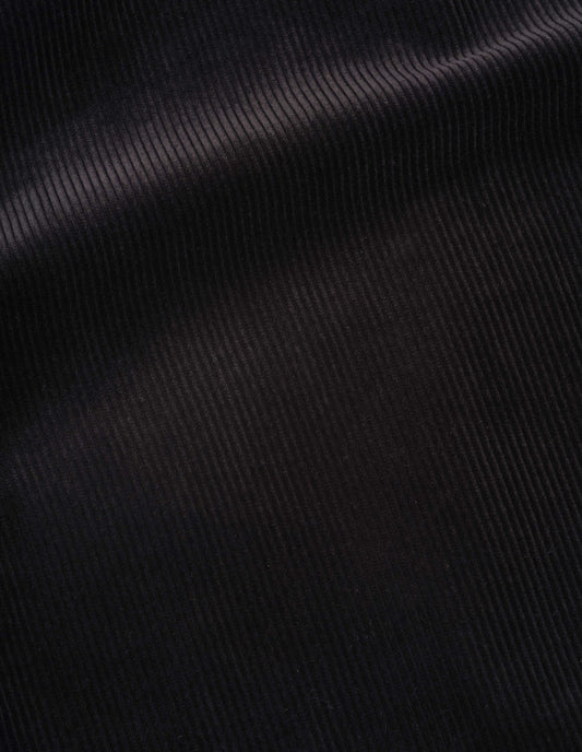 Black heavy corduroy trousers, fabric swatch.