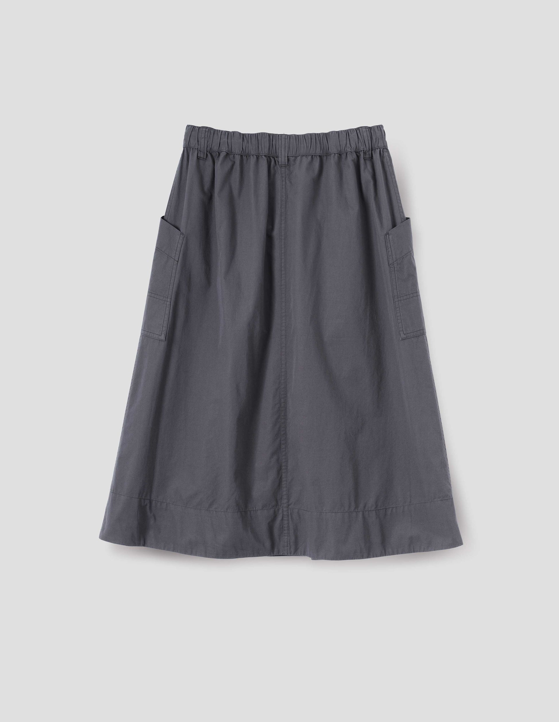 Greyish blue A-line skirt with elasticated waist, belt loops and large, slant side patch pockets with reinforced stitch detailing, back flat lay view.
