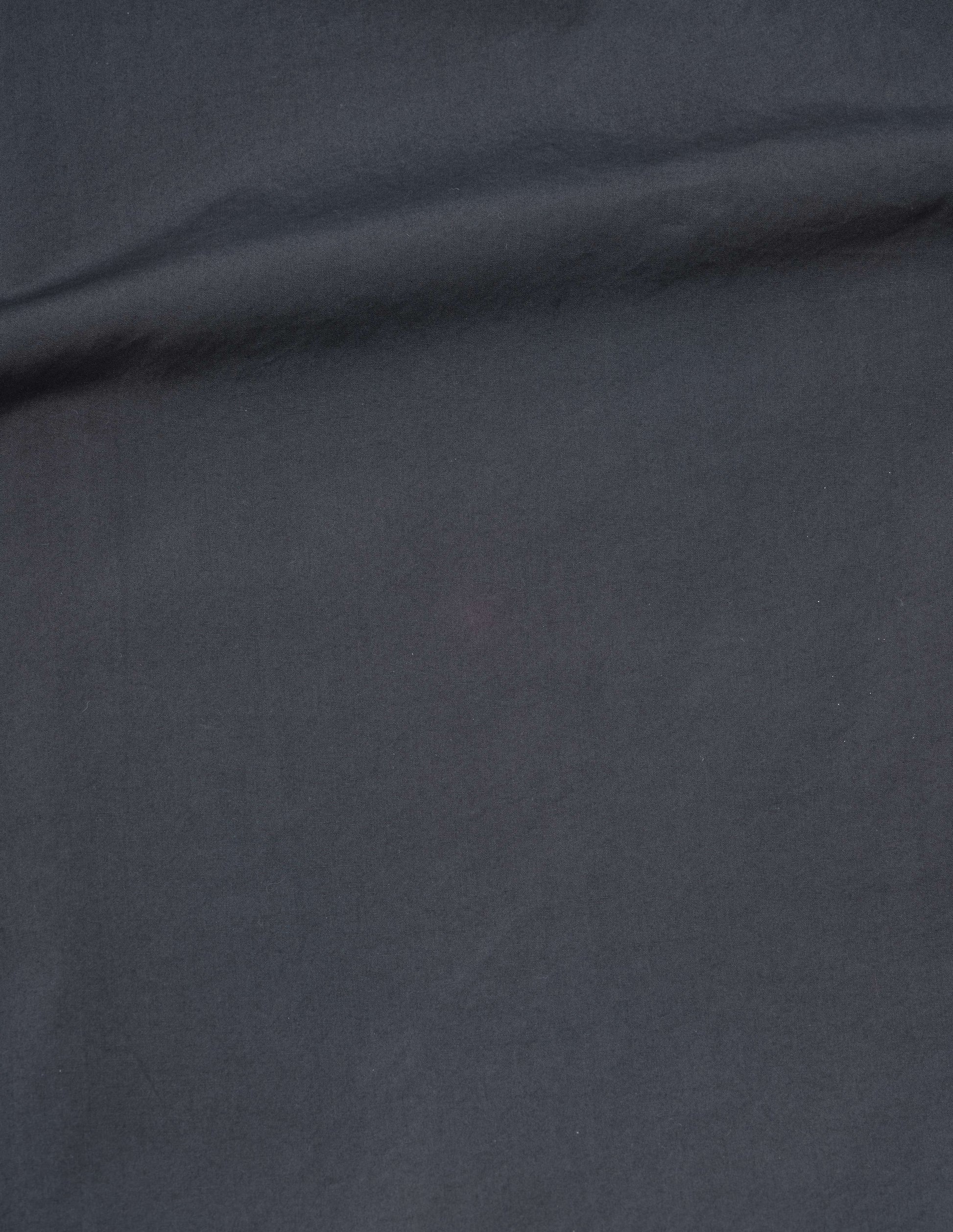 Greyish blue washed cotton poplin skirt fabric swatch.