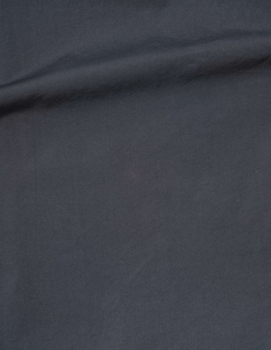 Greyish blue washed cotton poplin skirt fabric swatch.