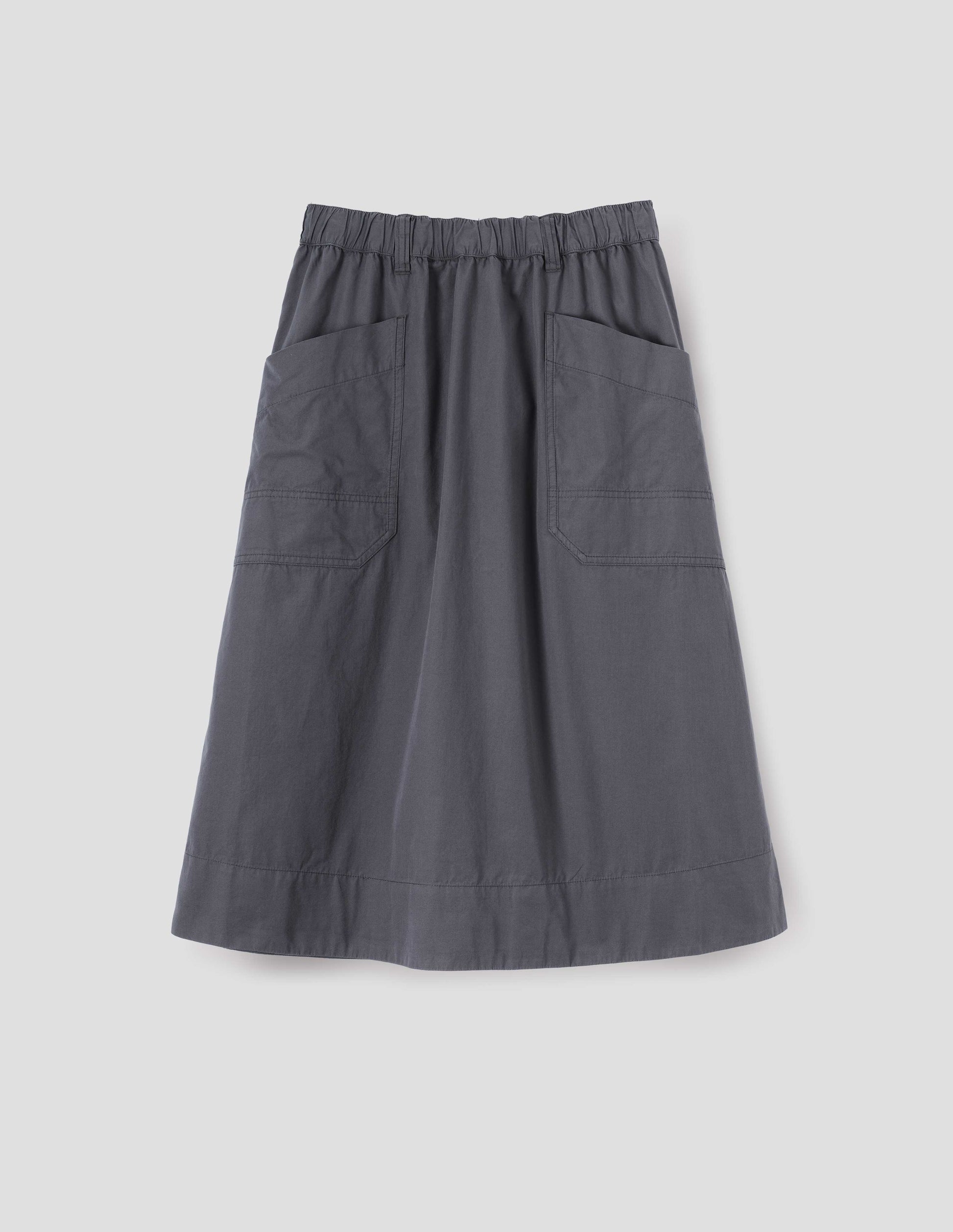 Greyish blue A-line skirt with elasticated waist, belt loops and large, slant patch pockets with reinforced stitch detailing, front flat lay view.