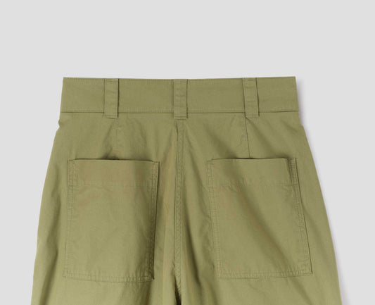Green trousers with  patch back pockets and deep stitch hem. Back flat lay view. 