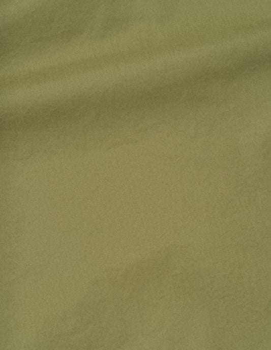 Green soft dense cotton trousers, fabric swatch. 