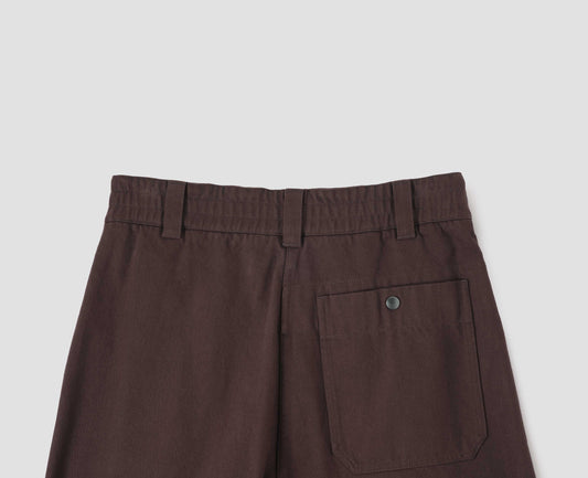 Red brown culottes, with half elasticated waist, belt loops and press stud patch back pocket, back flat lay view.