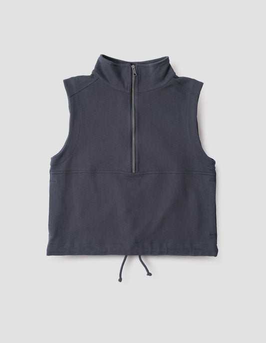 Dark blue half zip high neck sleeveless track top with drawcord hem, front flat lay view.