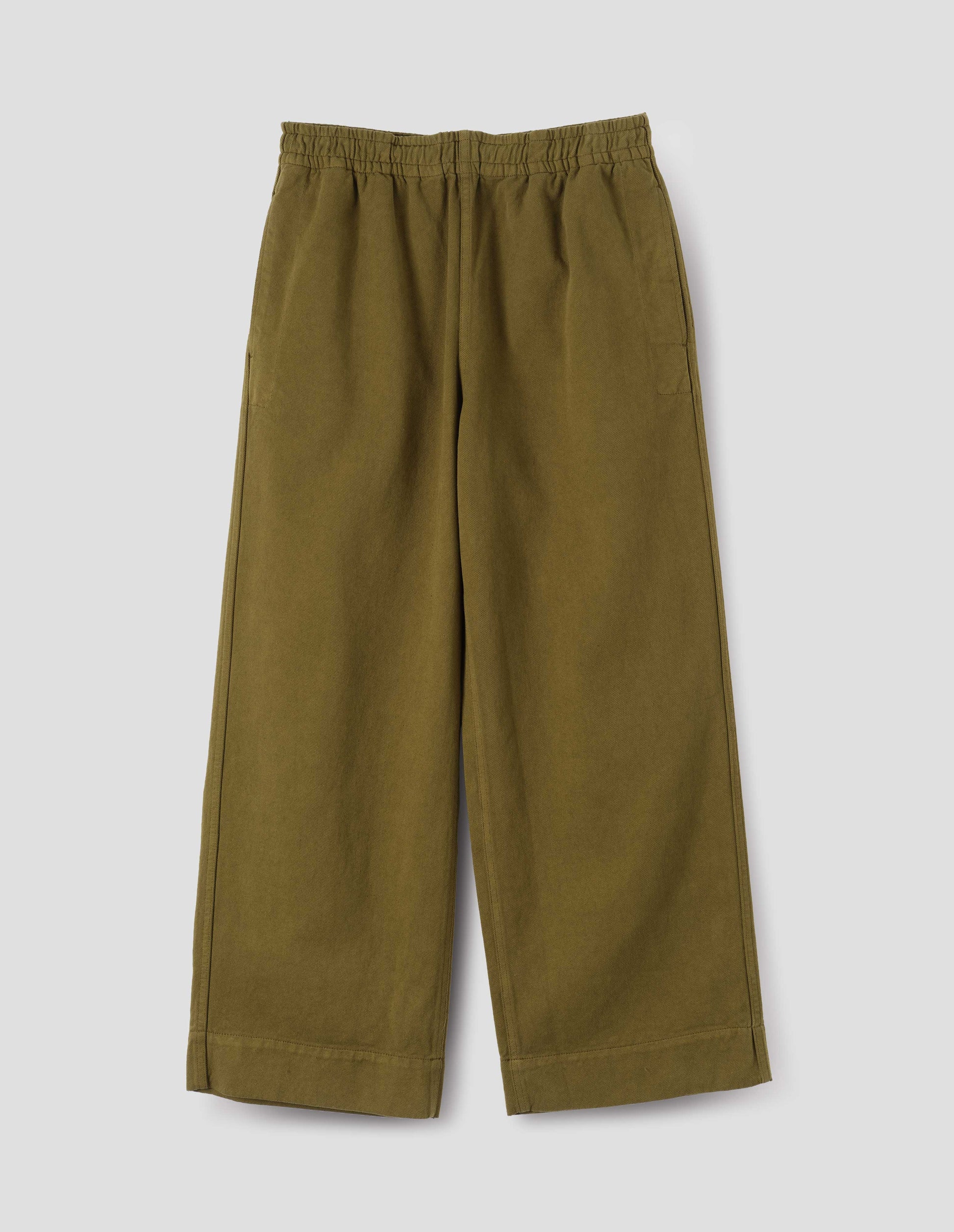 Green joggers with elasticated waistband and side seam pockets with reinforced stitch detailing, front flat lay view.