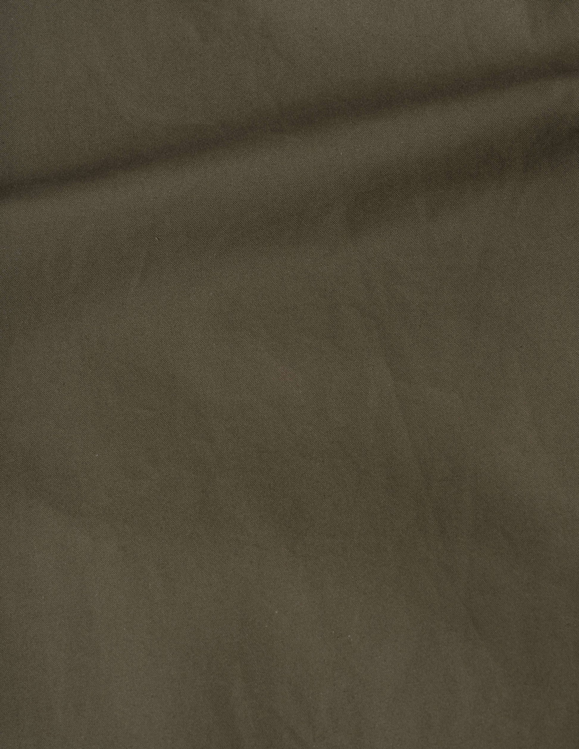 Khaki green dry cotton canvas coat fabric swatch.