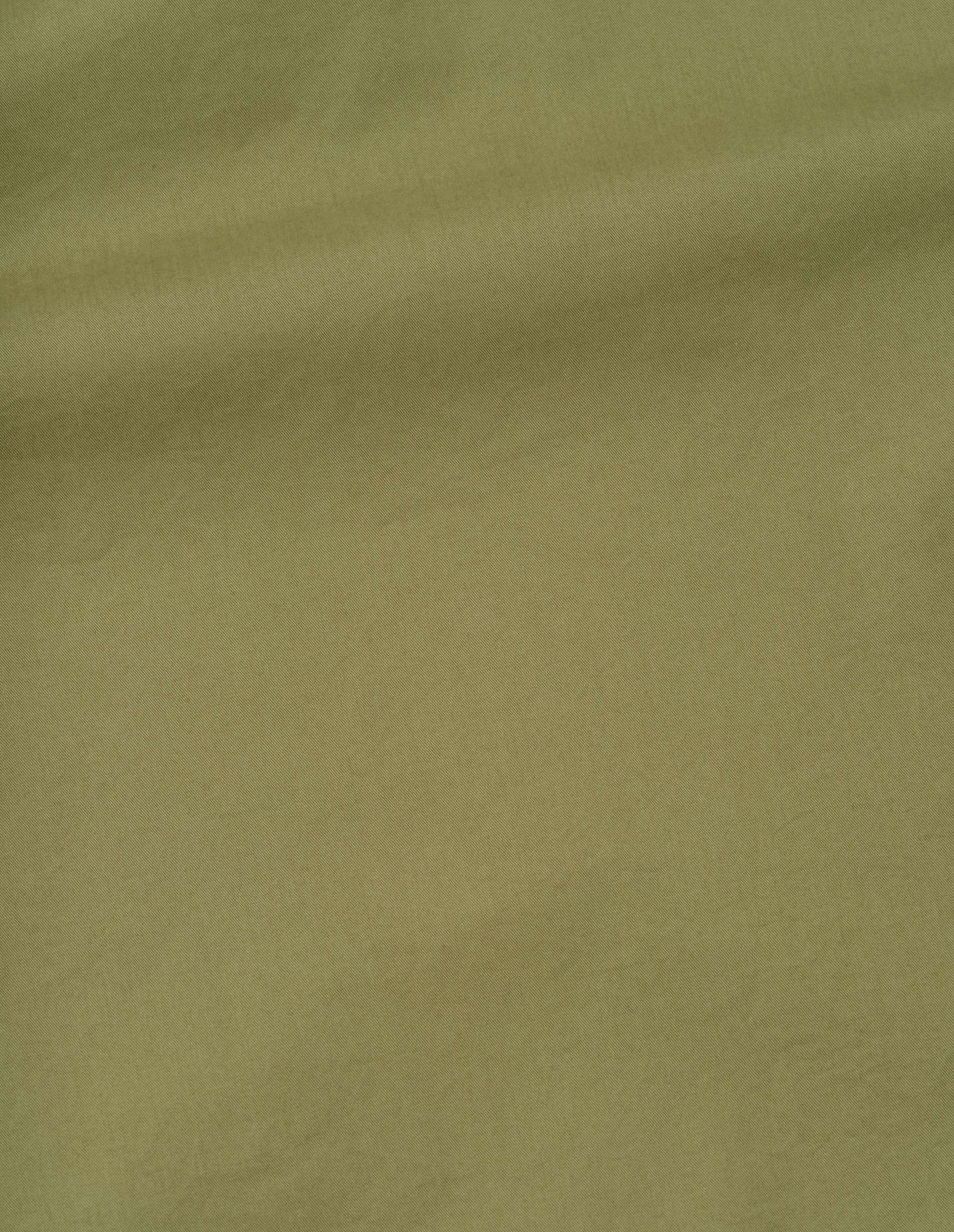 Green soft dense cotton dress, fabric swatch.