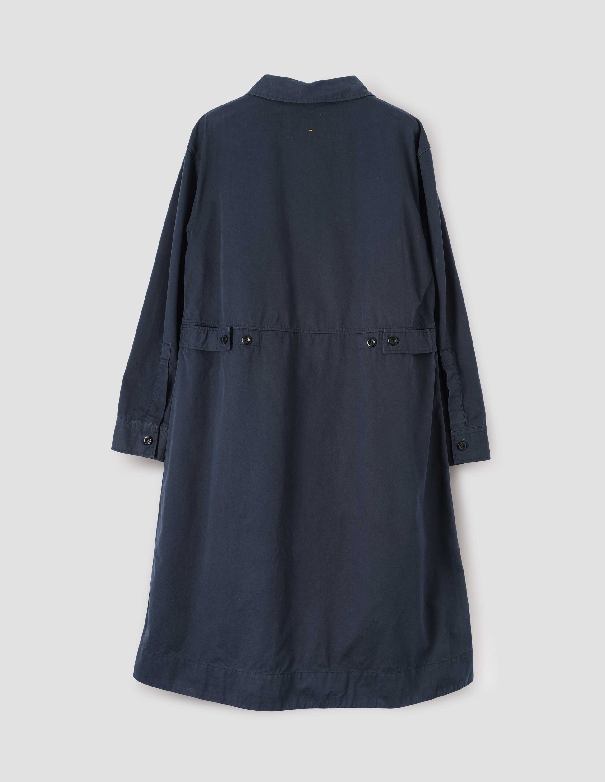 Dark blue long sleeve shirt dress with deep stitch hem and waist seam detail with button tab adjusters. Back flat lay view.