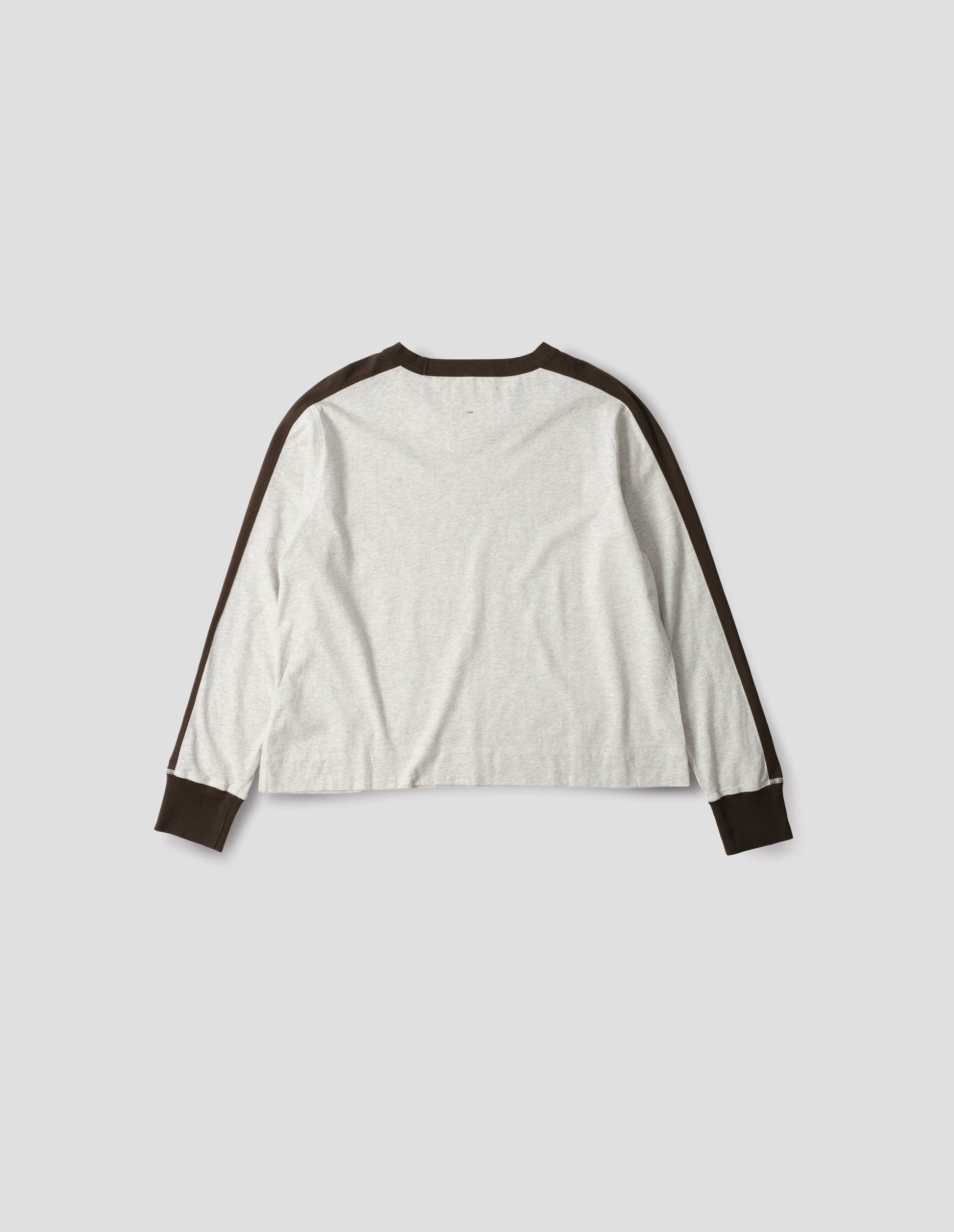 White long sleeve t-shirt with contrasting brown green stripe on cuffs, arms and neckline. Back flat lay view.