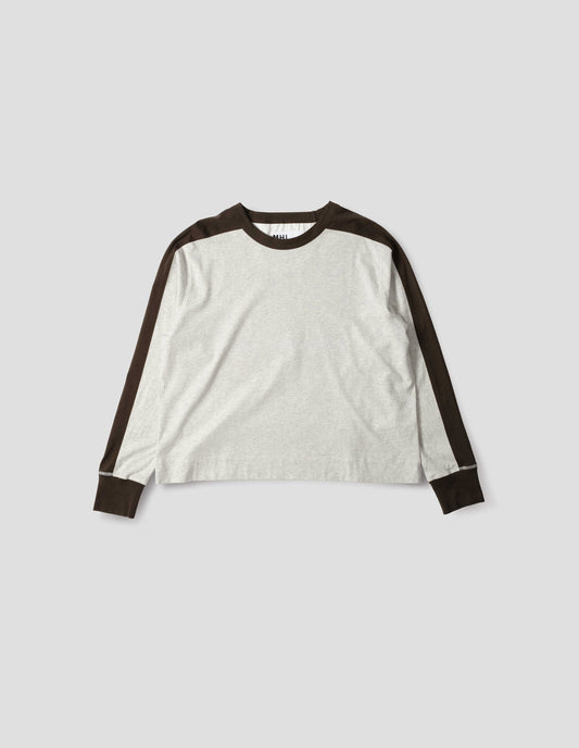White long sleeve t-shirt with contrasting brown green stripe on cuffs, arms and neckline. Front flat lay view.