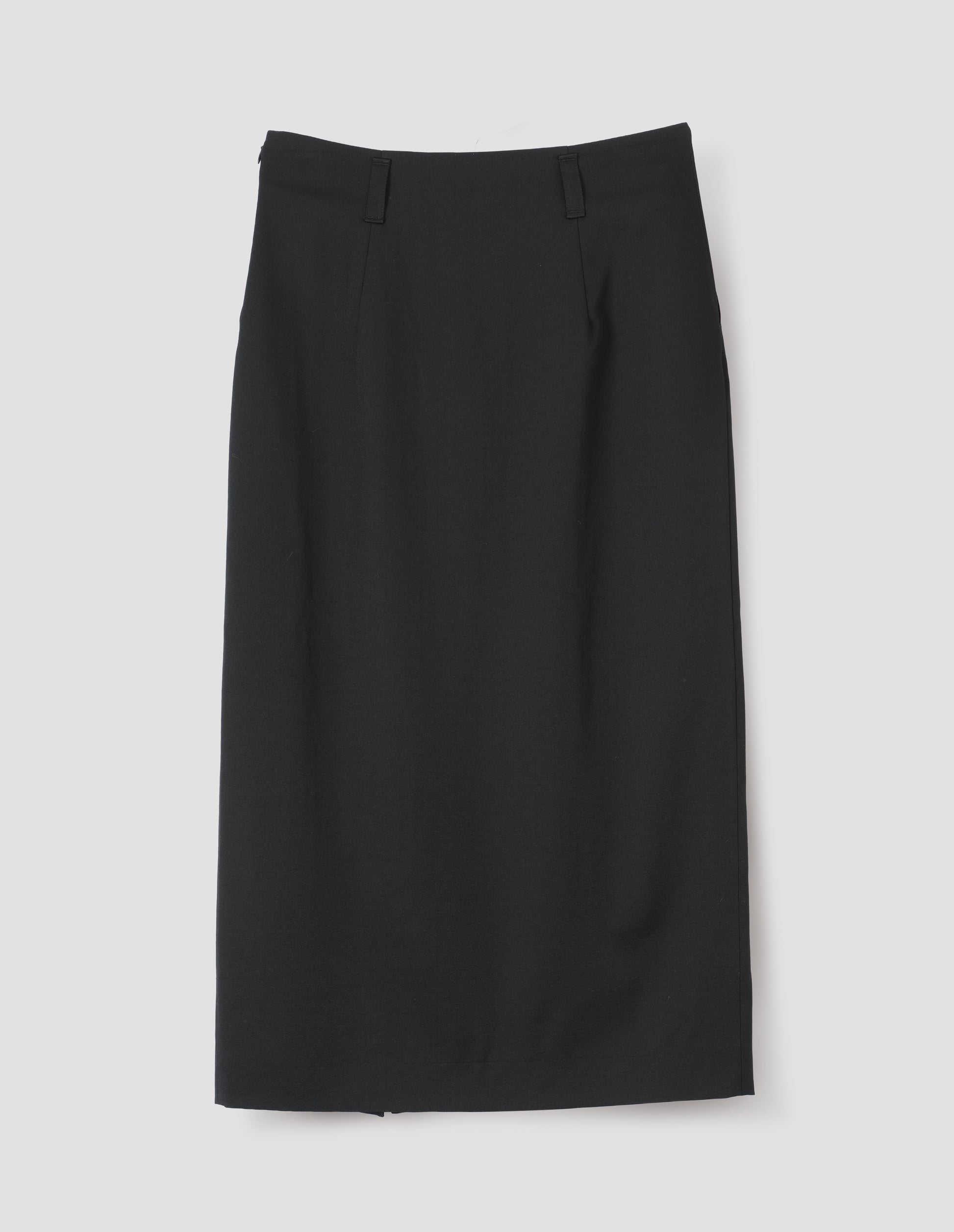 Black fluid wool twill vent skirt, with belt loops. Back flat lay view.