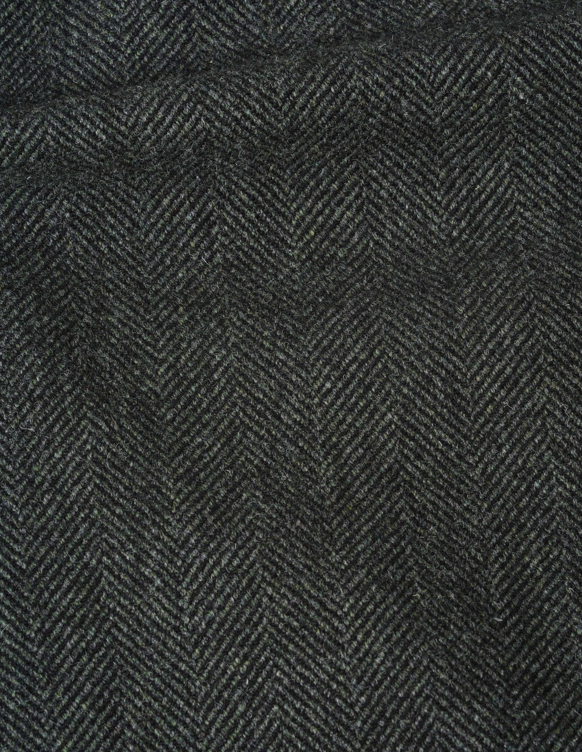 Green and black herringbone wool overcoat, fabric swatch.