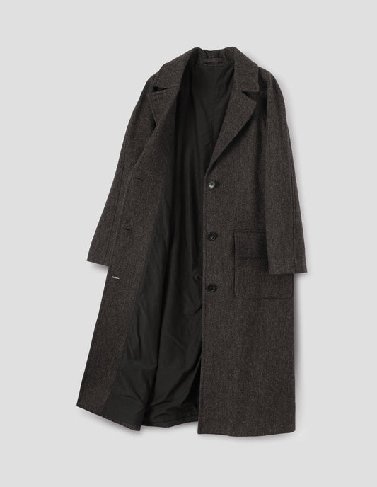Brown wool longline overcoat with raglan sleeve, button fastening lapel and deep flap patch pockets and fully lined in black cotton. Front flat lay open view.