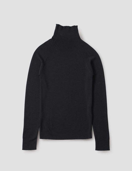 Black fine knit merino wool jumper, with high neck, raglan sleeve and cast off edging on neck, cuffs and hem. Back flat lay view.