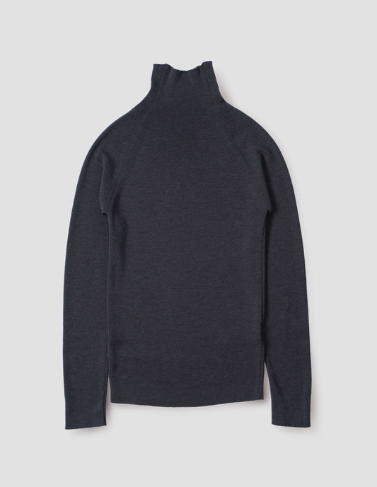 Dark grey fine knit merino wool jumper, with high neck, raglan sleeve and cast off edging on neck, cuffs and hem. Back flat lay view.