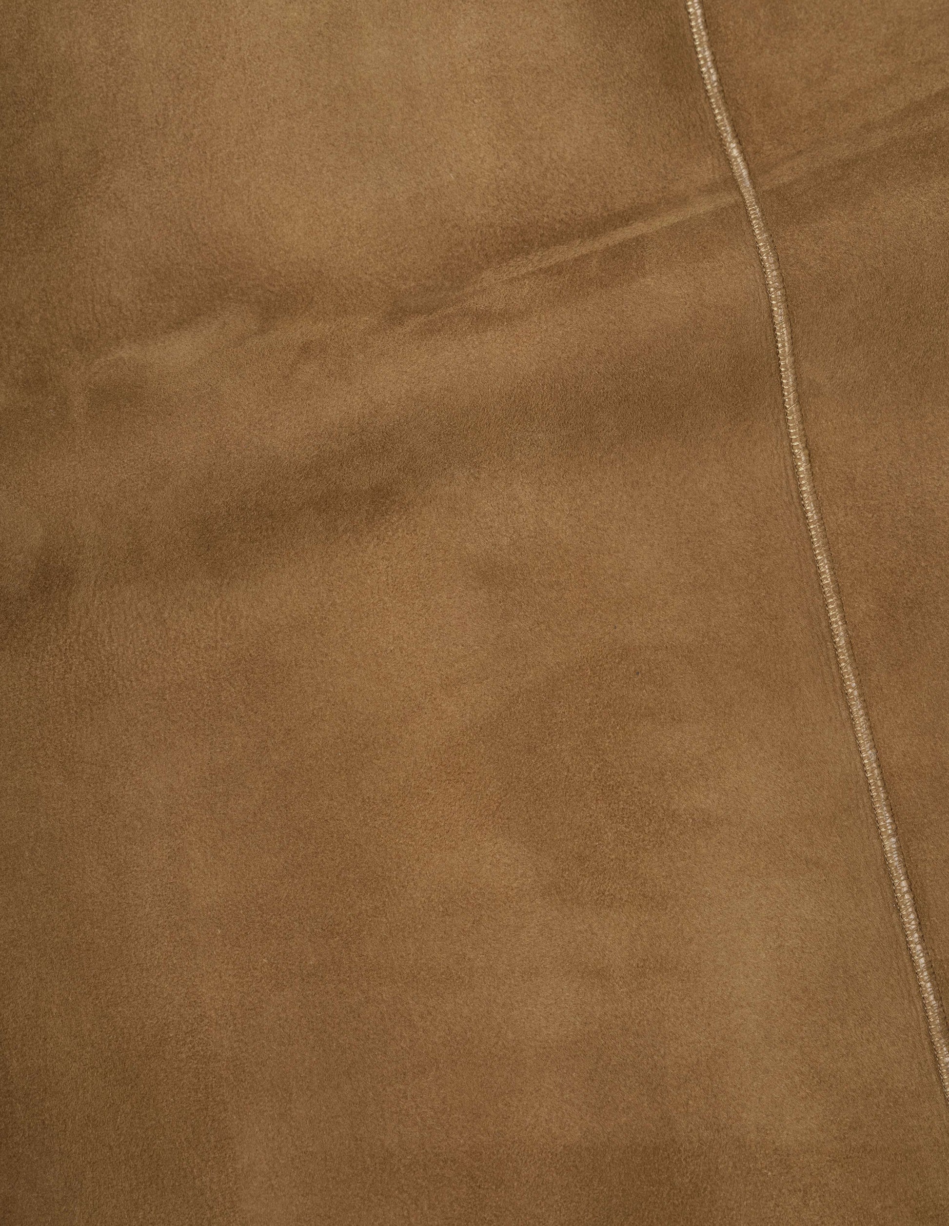 Tan and ecru shearling cropped jacket, fabric swatch. 