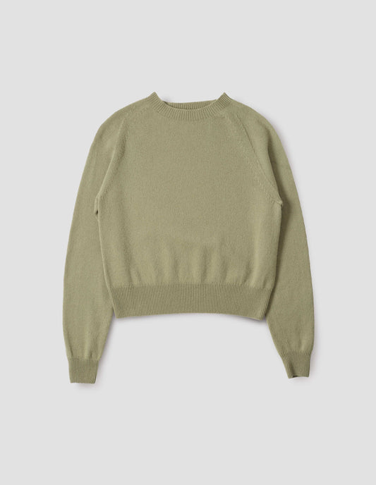 Light green long sleeve cashmere jumper, with raglan sleeve and contrasting rib on neck, cuffs and hem. Front flat lay view.