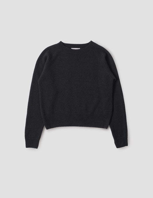 Black long sleeve cashmere jumper, with raglan sleeve and contrasting rib on neck, cuffs and hem. Front flat lay view.