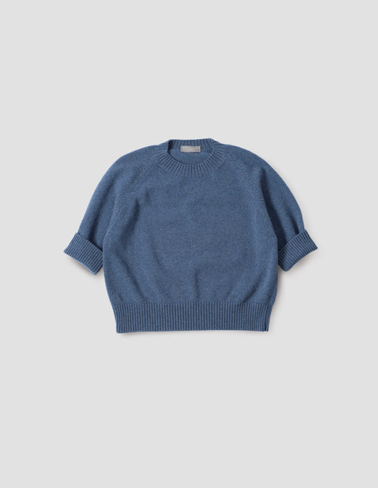 Blue short sleeve crew neck jumper with raglan sleeves, wide ribbed hem and turned up wide ribbed cuffs, front flat lay view.