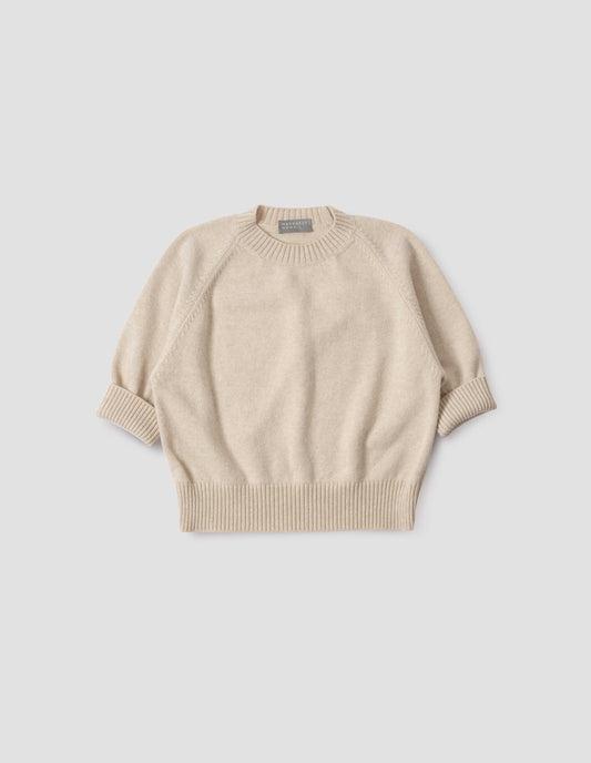 Beige short sleeve crew neck jumper with raglan sleeves, wide ribbed hem and turned up wide ribbed cuffs, front flat lay view.