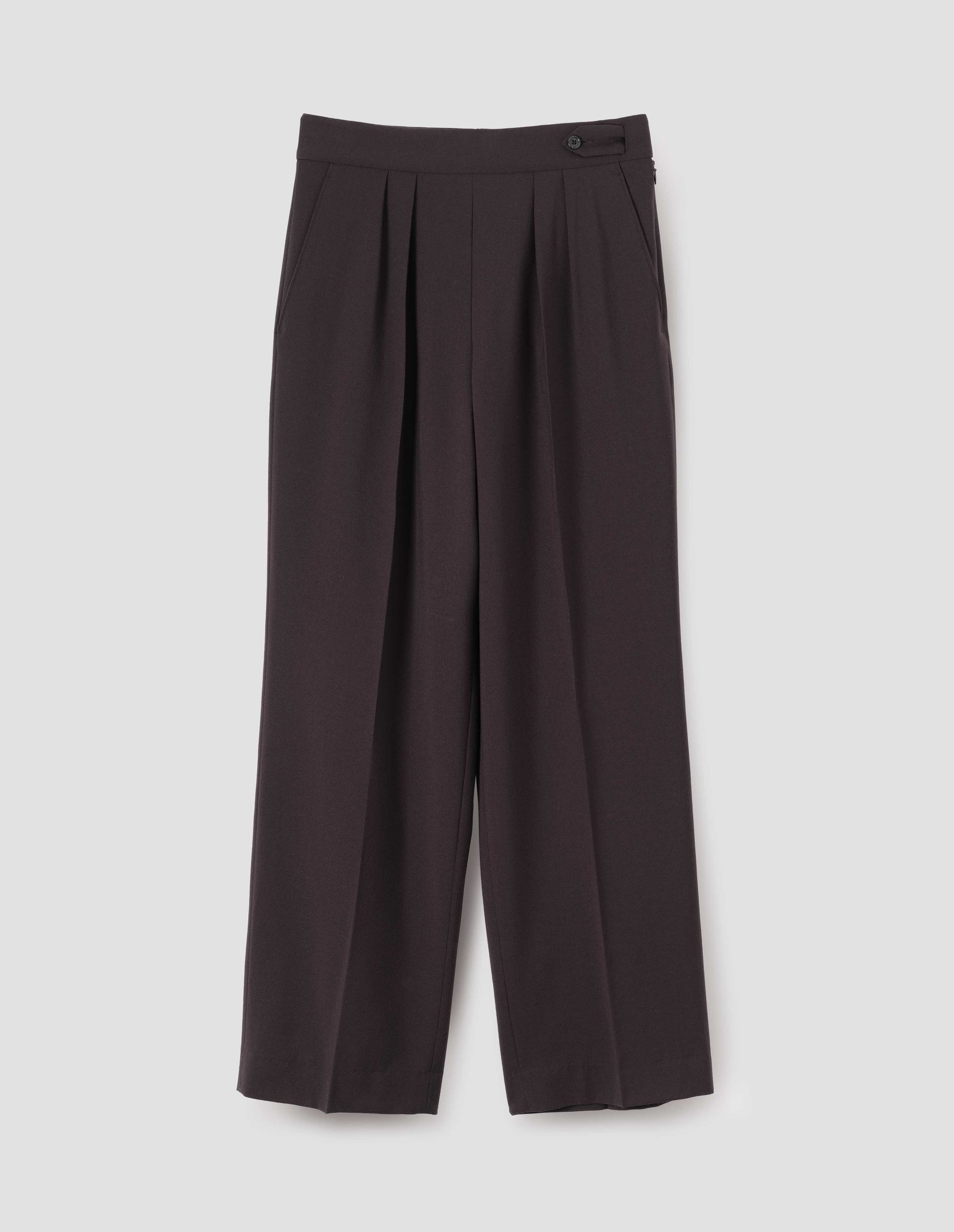 Brown double pleated wool trousers, with concealed side zip, pull through tab side fastening and slant pockets. Front flay lay view.