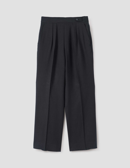 Black lightweight trousers with double pleats, concealed side zip, pull through double tab side fastening and slant side pockets, front flat lay view.