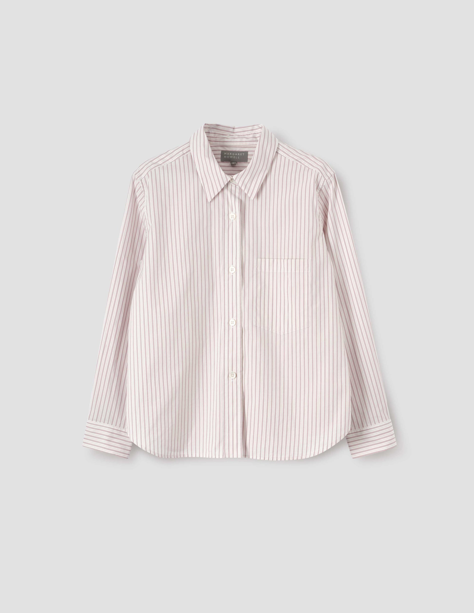 Beige, pink and black striped shirt with raised placket and mother of pearl buttons, patch pocket on chest. Front flat lay view.