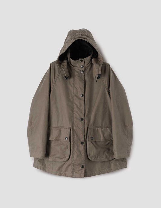 Dark beige parka with stand collar and hood with wire adjustable peak, raglan sleeve, press stud fastening storm flap and large bellows pockets with press stud fastening envelope closure. Front flat lay view.
