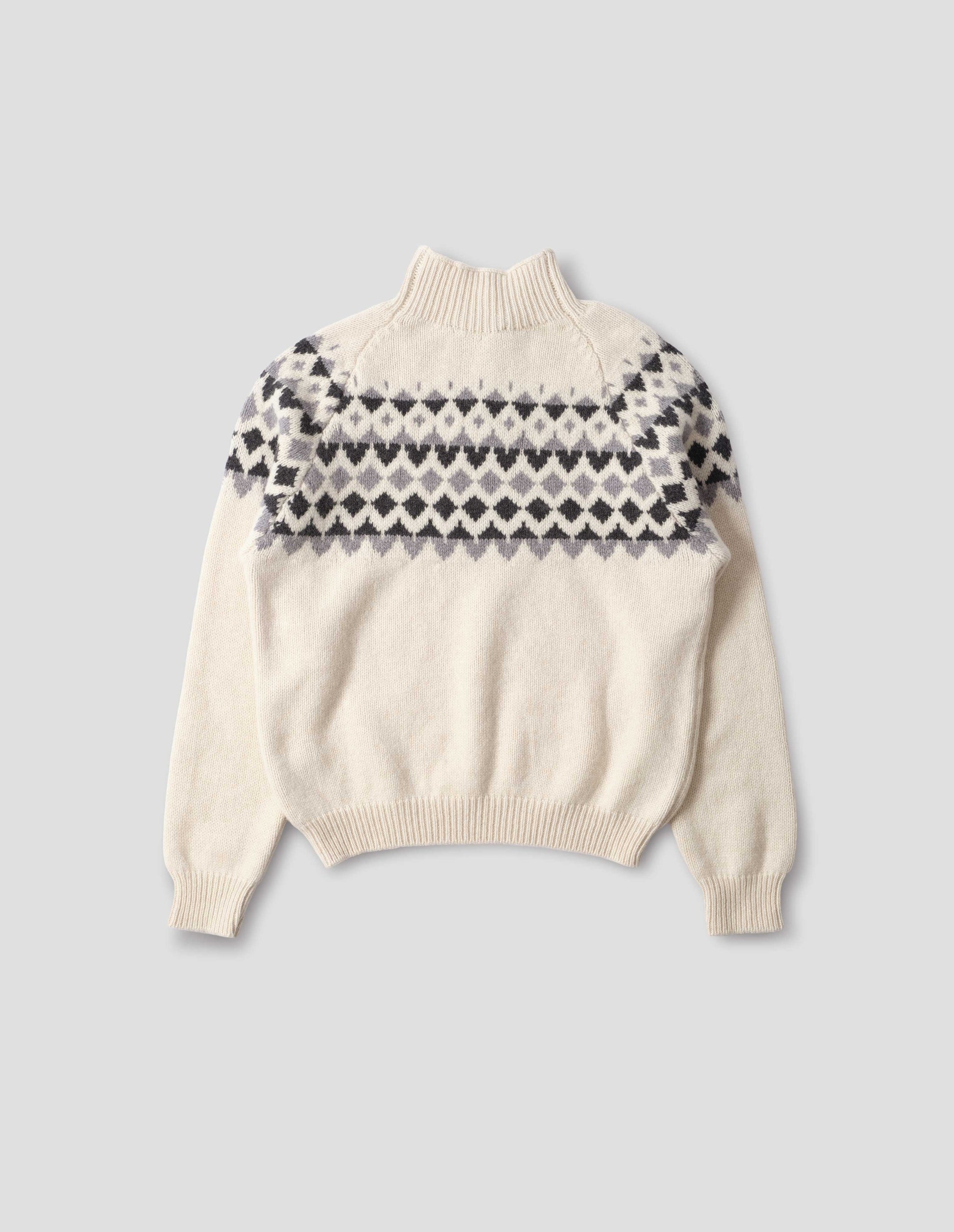 Ecru and grey fairisle jumper with inset sleeve and contrasting rib on high neck, cuffs and hem. Back flat lay view. 