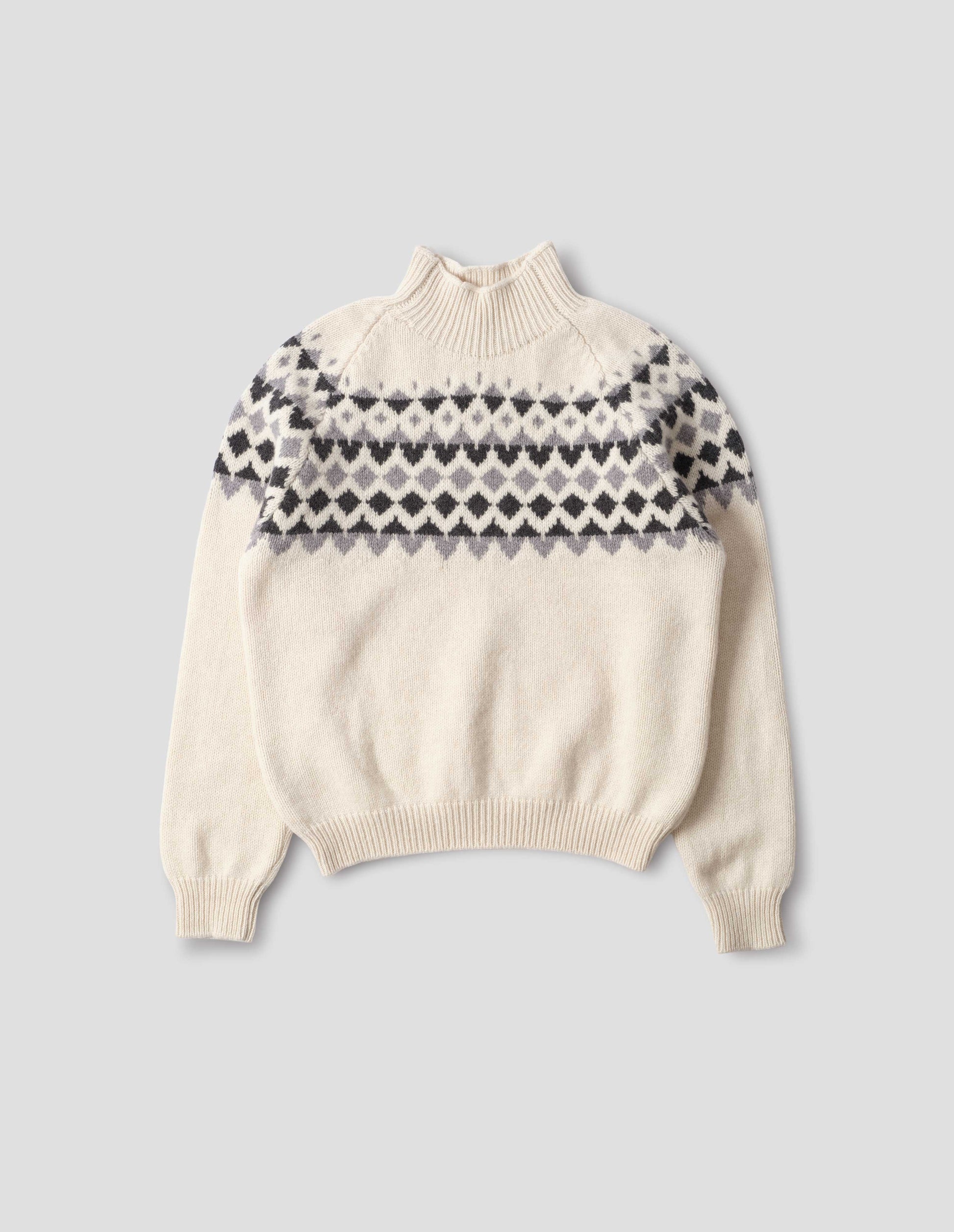 Ecru and grey fairisle jumper with inset sleeve and contrasting rib on high neck, cuffs and hem. Front flat lay view. 