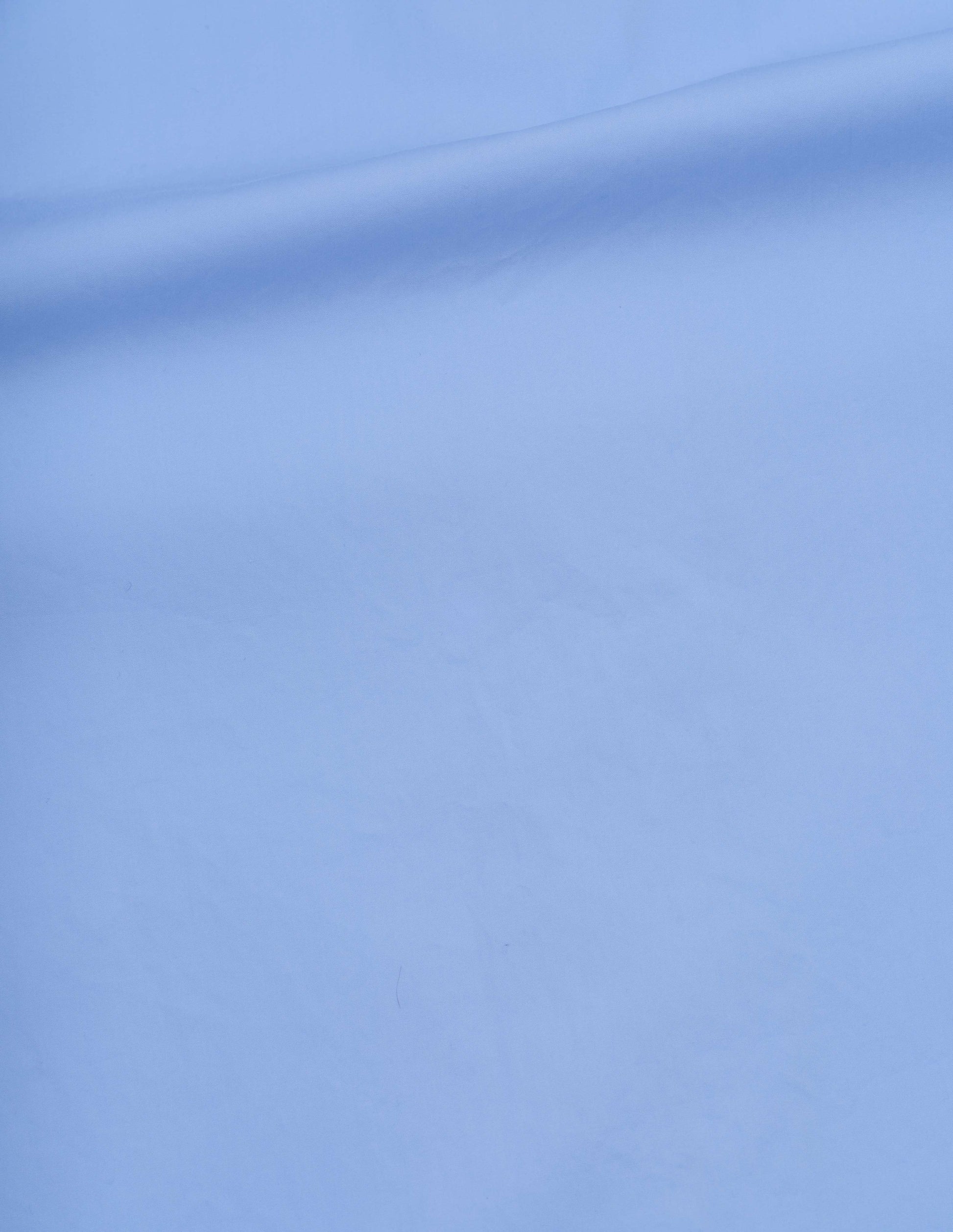 Light blue compact cotton plainweave shirt fabric swatch.