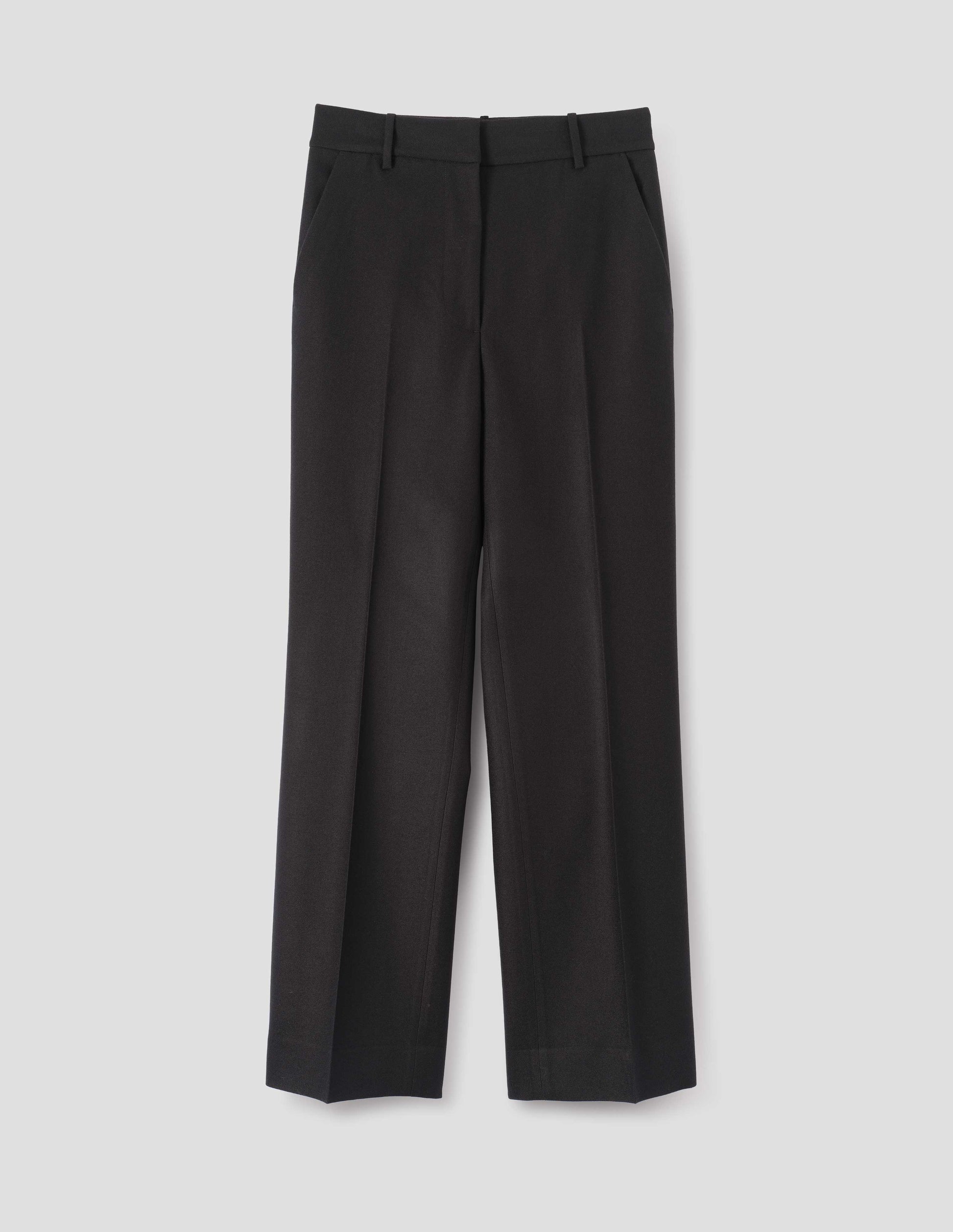 Black long leg wool trousers, with belt loops and side pockets. Front flat lay view.