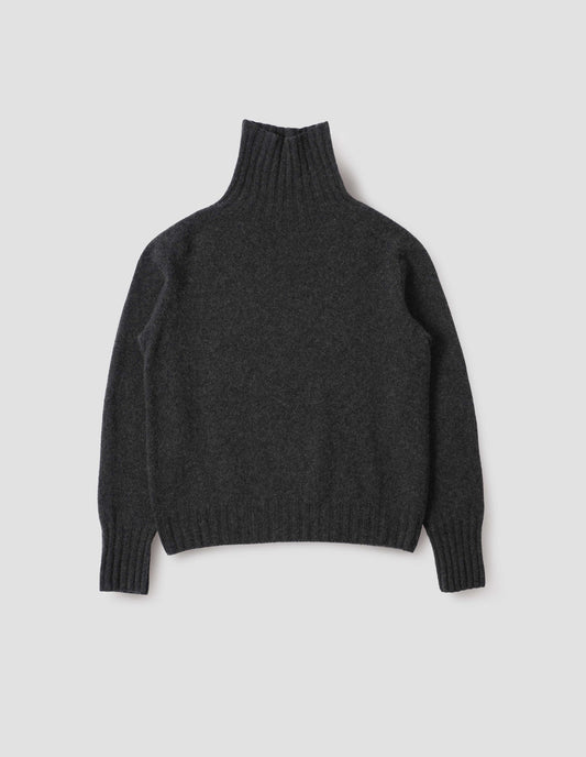 Charcoal grey high neck cashmere jumper, with saddle sleeve and contrasting wide rib on neck, cuffs and hem. Front flat lay view.