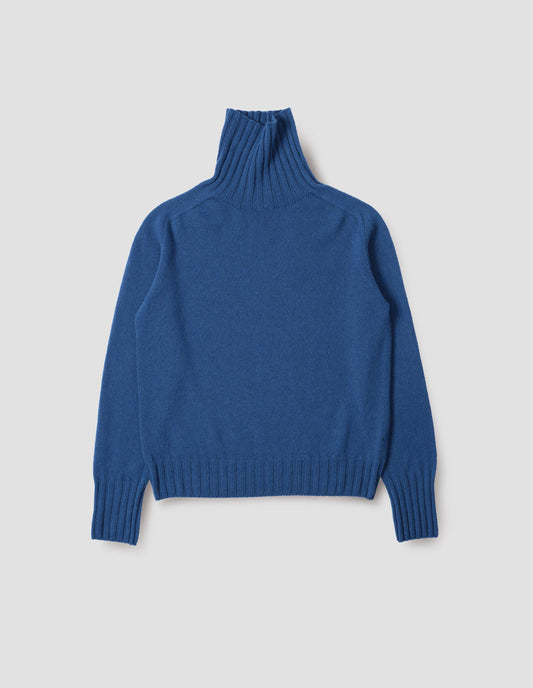 Blue high neck cashmere jumper, with saddle sleeve and contrasting wide rib on neck, cuffs and hem. Front flat lay view.