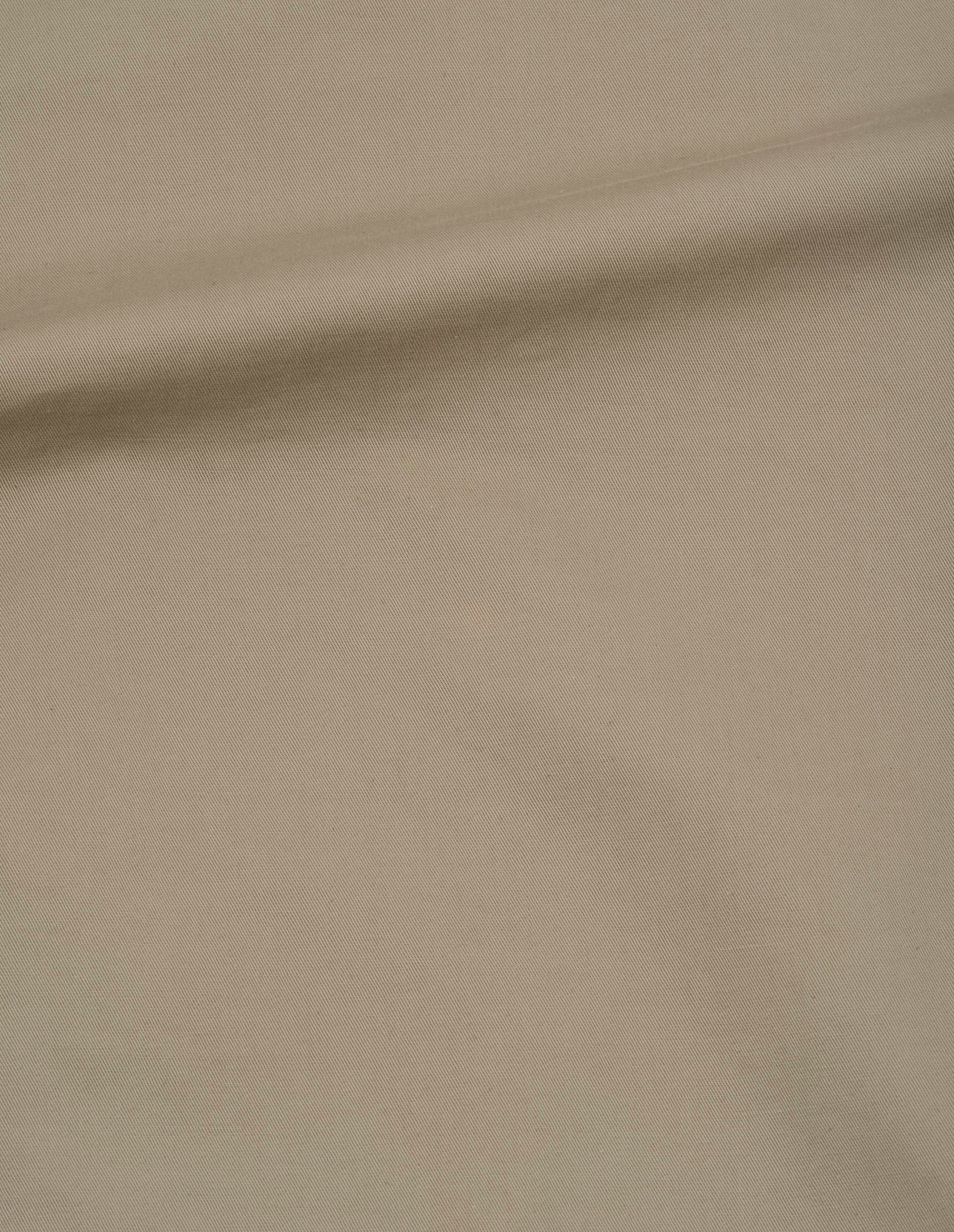 Beige compact cotton linen trousers fabric swatch.