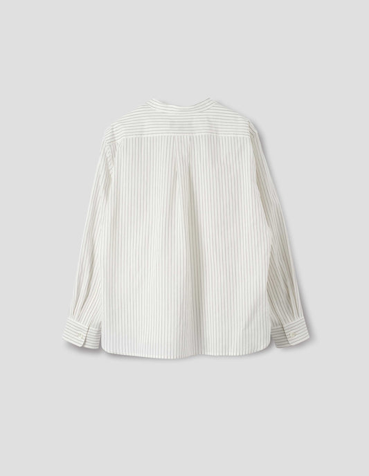 White collarless cotton and silk shirt with grey stripes, buttonhole detailing on collar band and box pleat on back yoke, mother of pearl buttons cuffs, elongated curved back hem. Back flat lay view. 