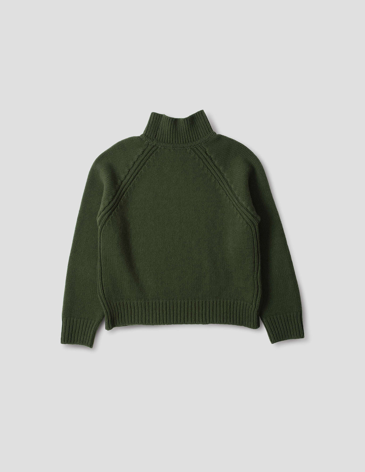 Green merino jumper with plain knitted back, raglan sleeves with ribbed side seams and ribbed high neck collar, cuffs and hem. Back flat lay view.