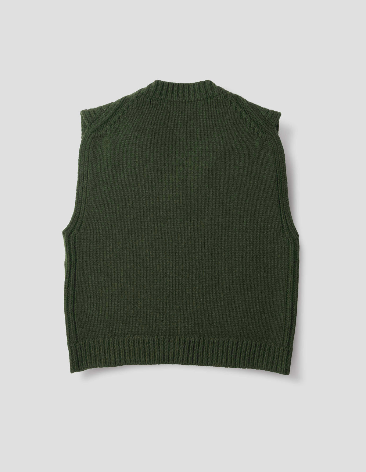 Green wool slipover with plain knitted back and ribbed neck, armholes, side seams and hem. Back flat lay view.