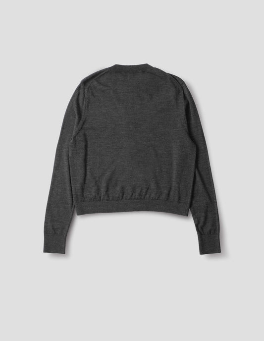 Dark grey merino cardigan with fully fashioned sleeves, French shoulder offset on back seam, and ribbed neck, cuffs and hem. Back flat lay view.